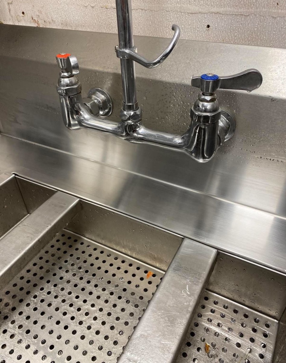 Commercial stainless sink top with patched hole polished invisible