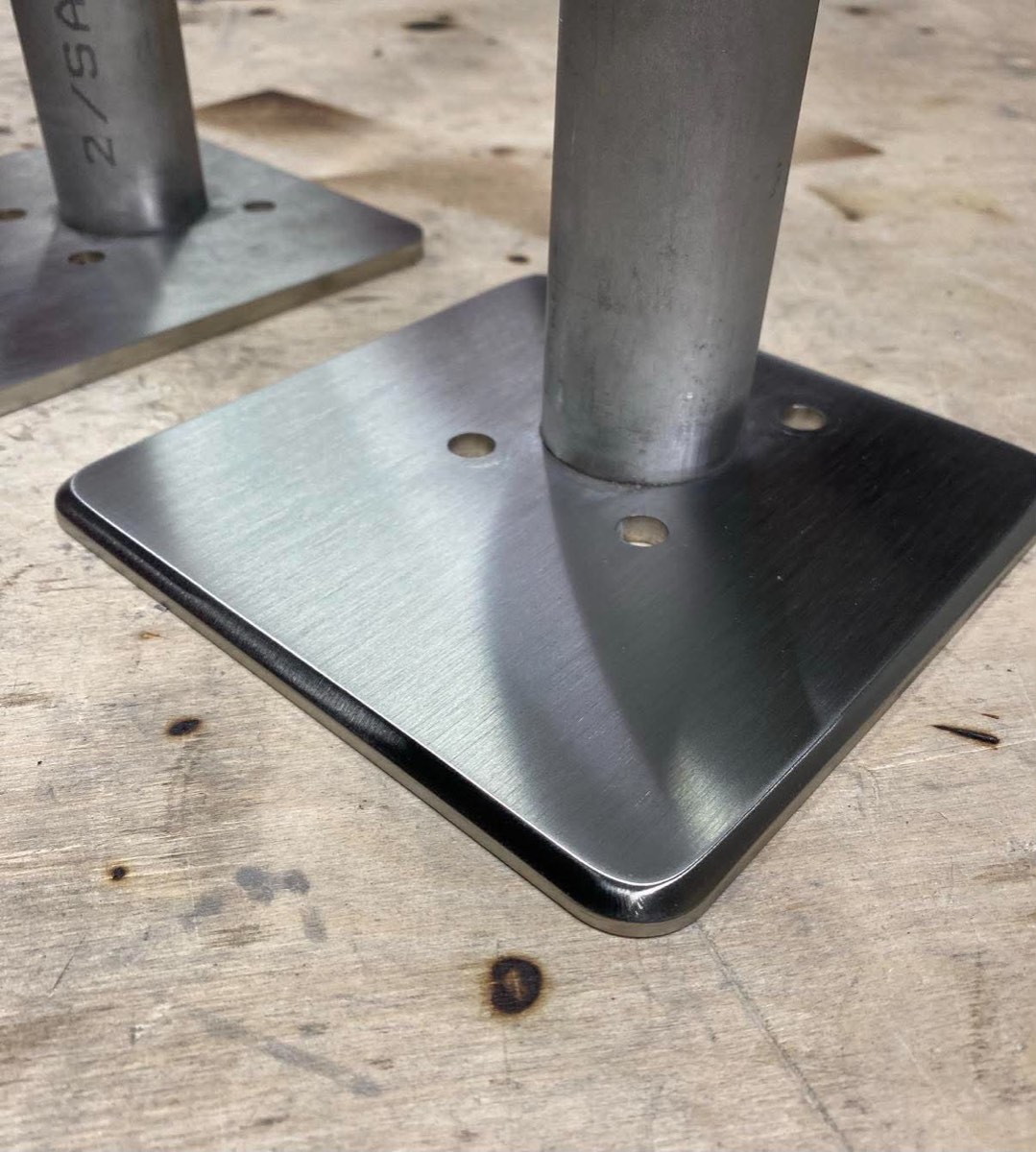 Polished stainless post base plates with bevelled edges