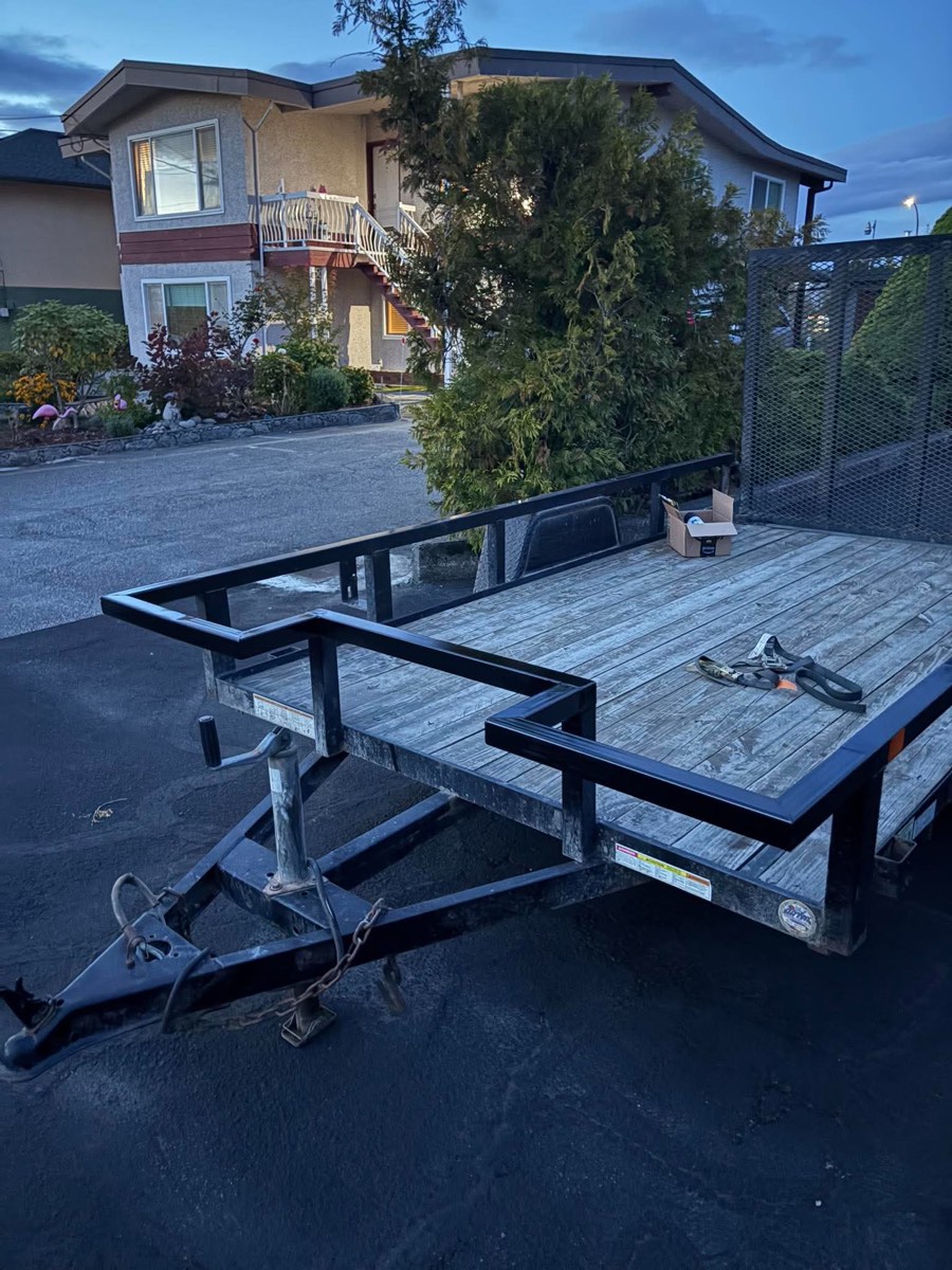 New front platform and rails painted black, stepped around the trailer's tongue jack
