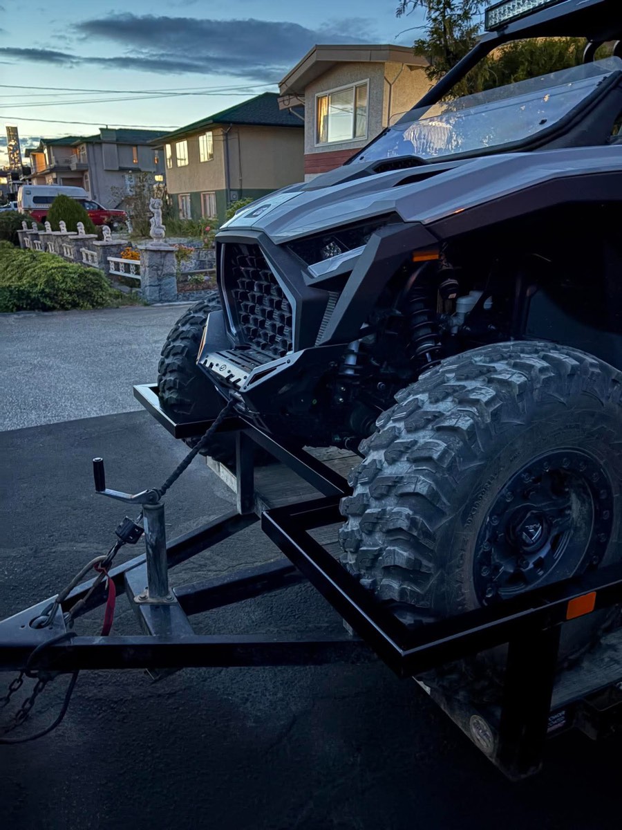 Side-by-side loaded on the extended trailer, front wheels on the new platform